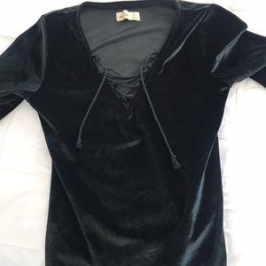 Black bodysuit, green/blue color tones in the sun